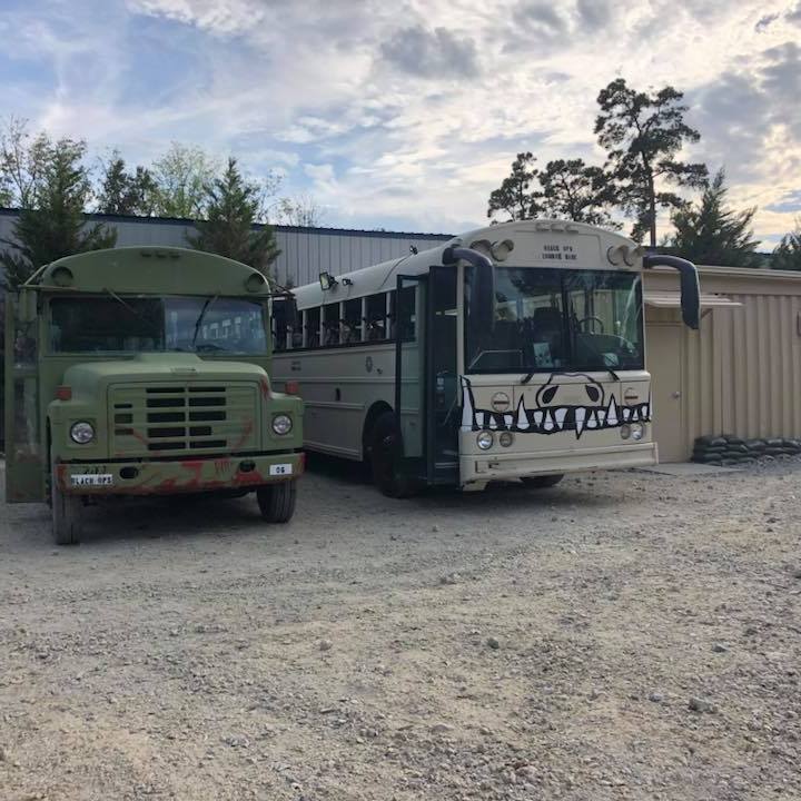 a truck driving down a dirt road